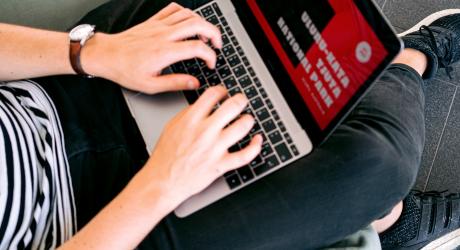 Person on laptop in an airport