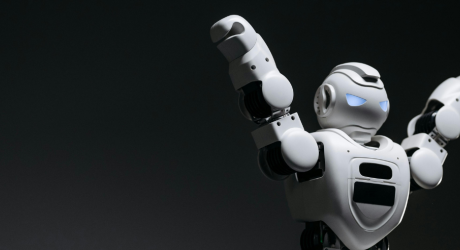 A robot with its arms in the air