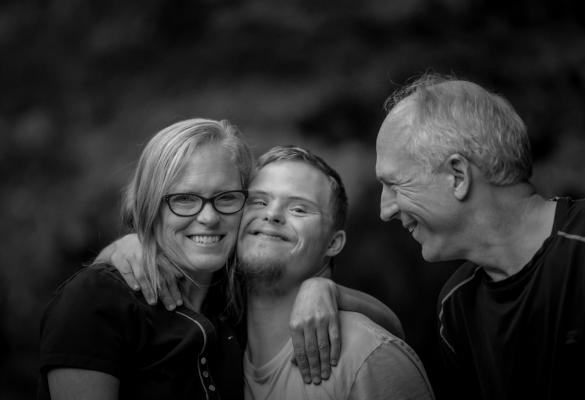 A family hugging and smiling